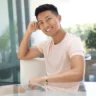 young-asian-man-smiles-while-600nw-2433309933